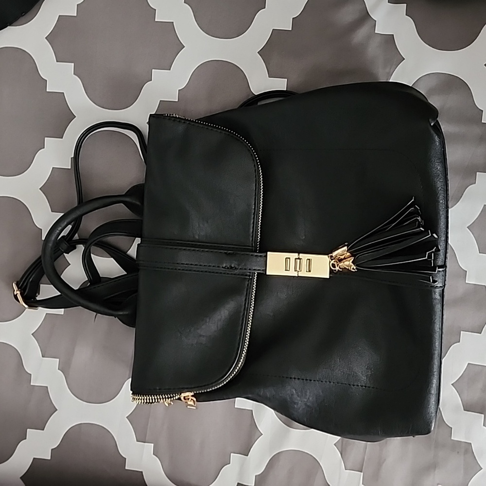 Black soft leather backpack purse.
